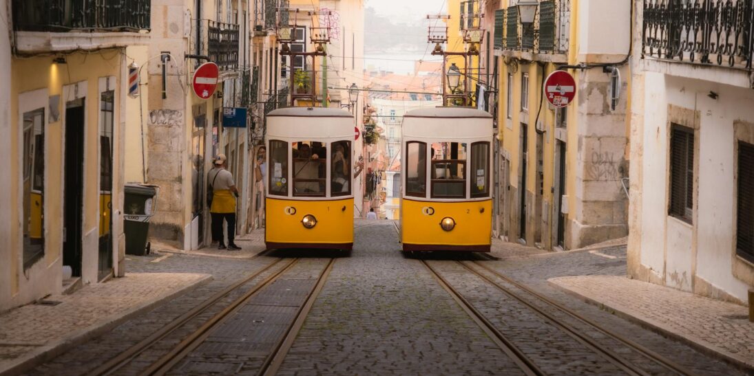 vintage yellow trams on lisbon s historic streets